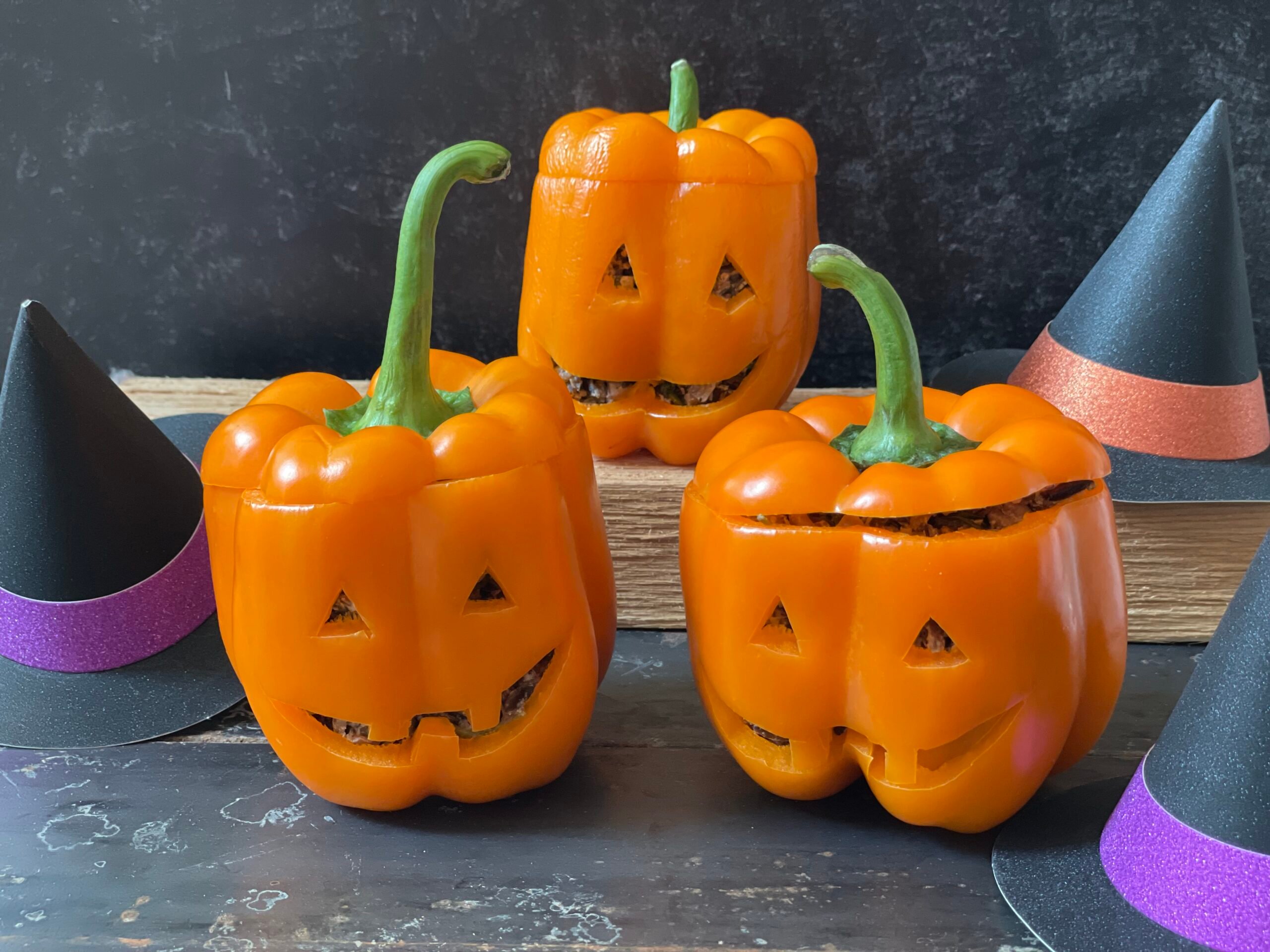 trio of stuffed bell pepper jack-o-lanterns