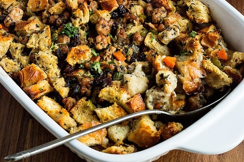 Sausage and mushroom stuffing with a serving spoon
